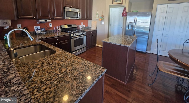 85 Malek Dr, Hanover, PA 17331 - kitchen with appliances with stainless steel finishes, a sink, dark wood finished floors, a center island, and dark stone counters