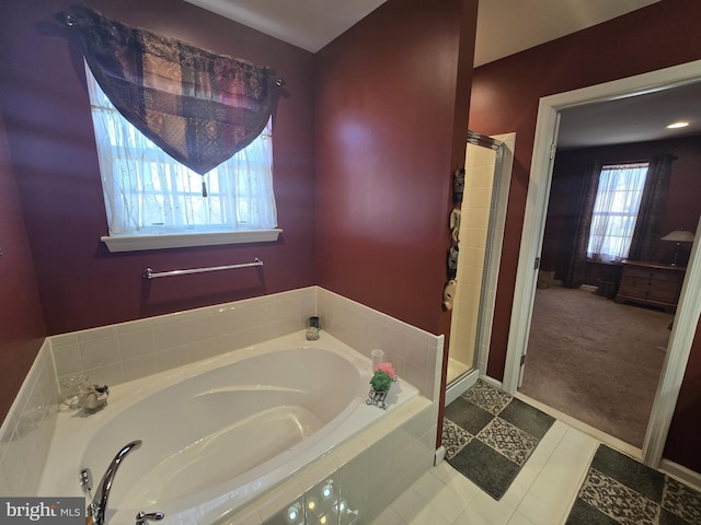 85 Malek Dr, Hanover, PA 17331 - bathroom featuring a stall shower, a garden tub, and baseboards