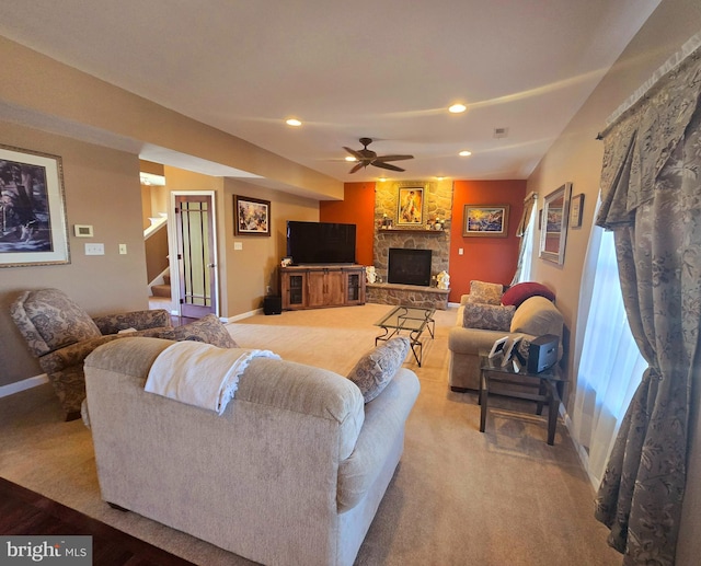 85 Malek Dr, Hanover, PA 17331 - carpeted living room with baseboards, a stone fireplace, stairway, a ceiling fan, and recessed lighting