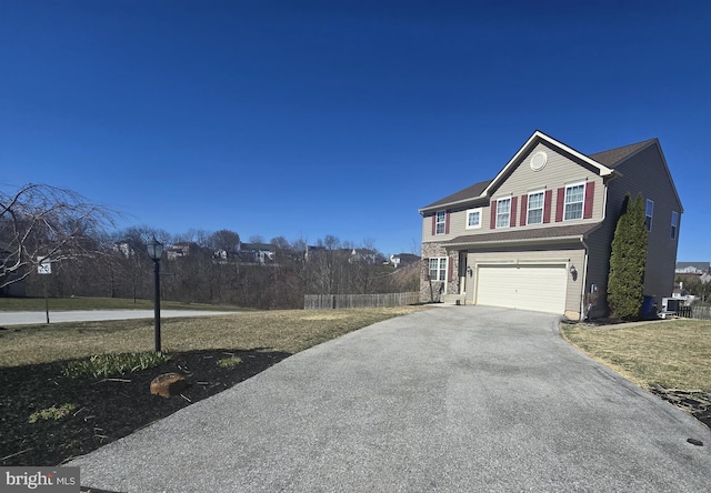 85 Malek Dr, Hanover, PA 17331 - view of side of property featuring driveway, an attached garage, and fence