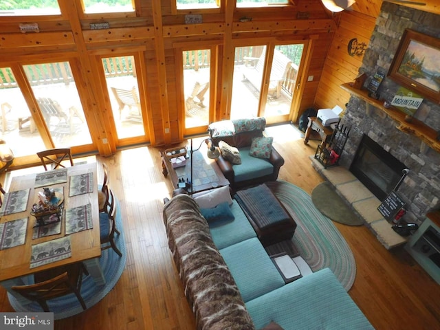 158 Hideaway Ln, Upper Tract, WV 26866 - living area with a fireplace, wood walls, and light wood finished floors