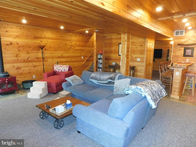 158 Hideaway Ln, Upper Tract, WV 26866 - carpeted living room featuring a wood stove, stairway, wooden walls, wood ceiling, and recessed lighting