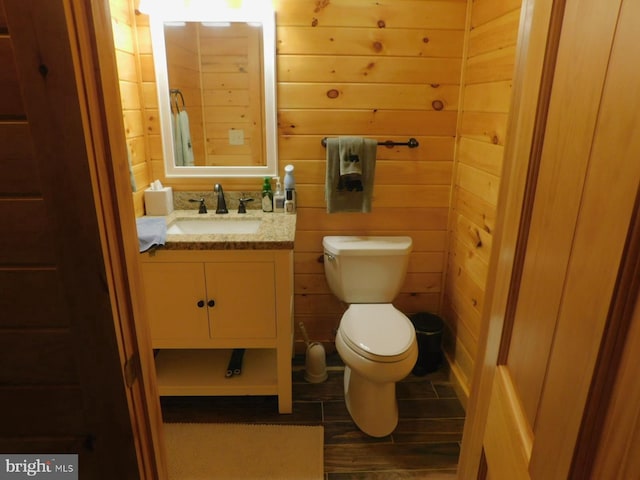 158 Hideaway Ln, Upper Tract, WV 26866 - bathroom with toilet, vanity, and wood walls