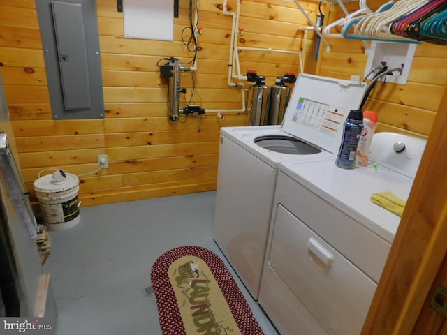 158 Hideaway Ln, Upper Tract, WV 26866 - washroom featuring separate washer and dryer, electric panel, and wooden walls