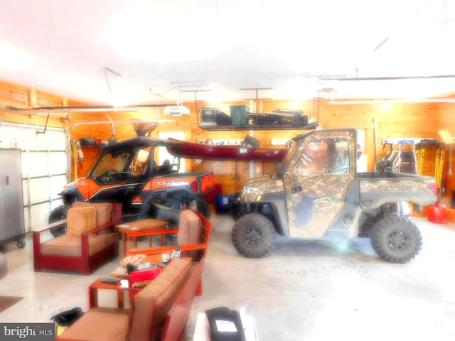 158 Hideaway Ln, Upper Tract, WV 26866 - garage with wood walls and a garage door opener