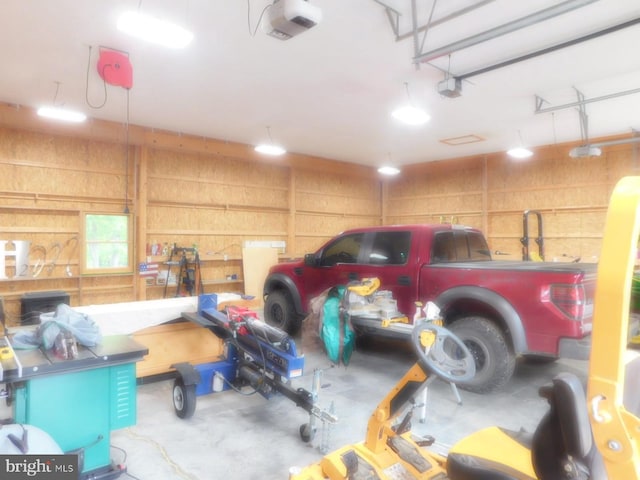 158 Hideaway Ln, Upper Tract, WV 26866 - garage featuring wooden walls and a garage door opener