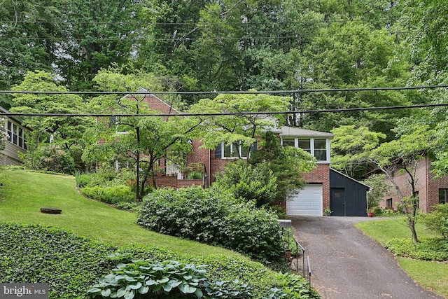 3919 30th St N, Arlington, VA 22207 - view of front of property with driveway, brick siding, a front lawn, and an attached garage