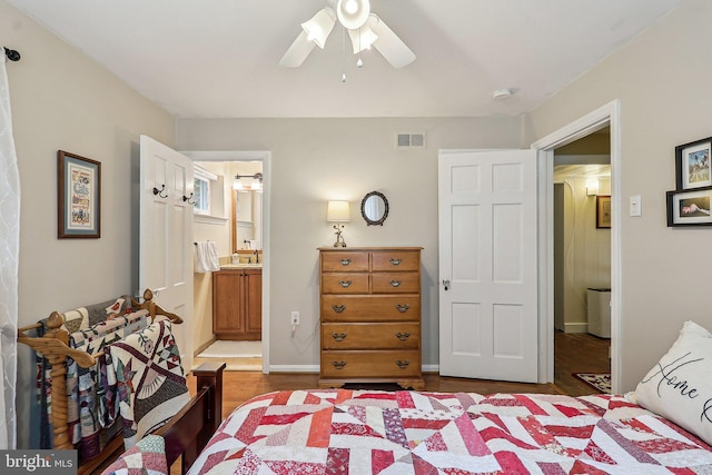 3919 30th St N, Arlington, VA 22207 - bedroom featuring wood finished floors, a ceiling fan, ensuite bathroom, a sink, and baseboards