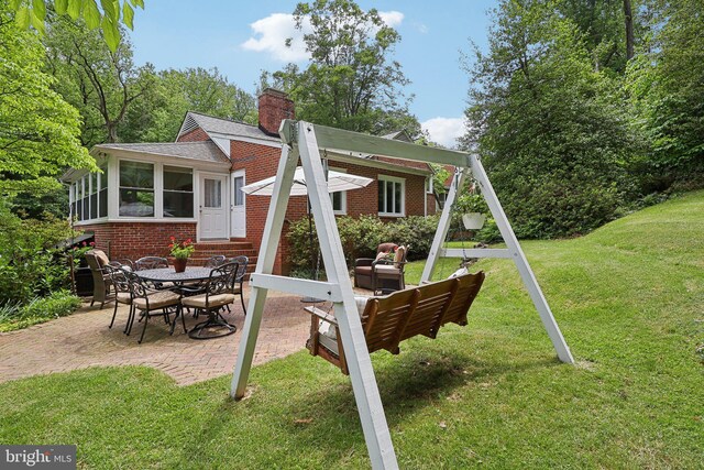 3919 30th St N, Arlington, VA 22207 - view of play area featuring a patio, entry steps, and a lawn
