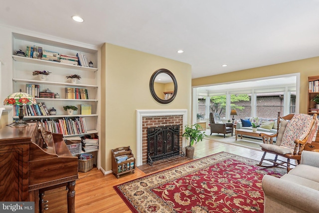 3919 30th St N, Arlington, VA 22207 - living area featuring a brick fireplace, wood finished floors, and recessed lighting