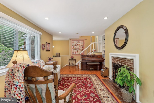 3919 30th St N, Arlington, VA 22207 - living area with stairway, recessed lighting, wood finished floors, and a brick fireplace