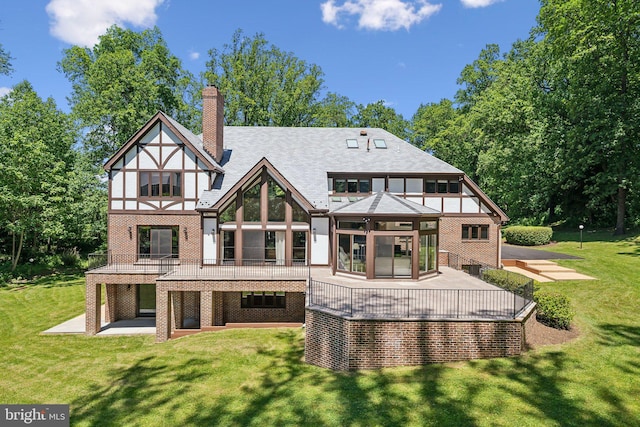 6723 Georgetown Pike, Mclean, VA 22101 - back of house with a lawn, a patio area, a chimney, and brick siding