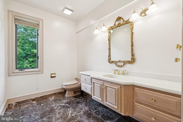 6723 Georgetown Pike, Mclean, VA 22101 - bathroom featuring vanity, toilet, baseboards, and marble finish floors