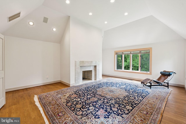 6723 Georgetown Pike, Mclean, VA 22101 - living room with lofted ceiling, wood finished floors, baseboards, a premium fireplace, and recessed lighting