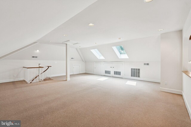 6723 Georgetown Pike, Mclean, VA 22101 - bonus room featuring a skylight, light carpet, lofted ceiling, baseboards, and recessed lighting