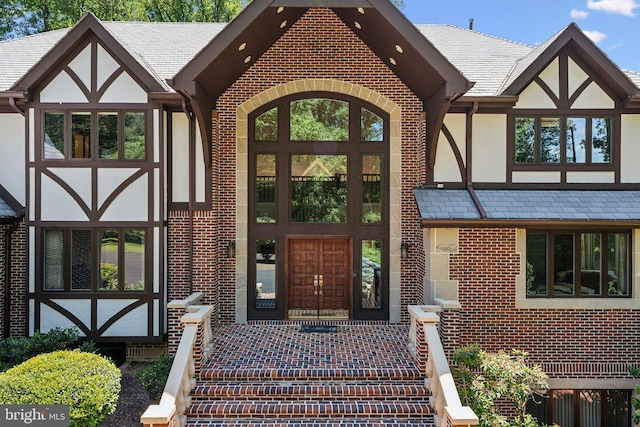 6723 Georgetown Pike, Mclean, VA 22101 - doorway to property featuring stucco siding and brick siding