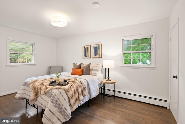 5632 Maxine Ct, Alexandria, VA 22310 - bedroom featuring baseboard heating, wood finished floors, and baseboards