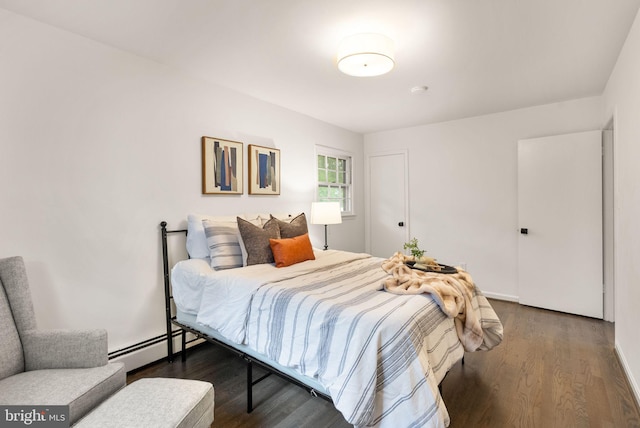 5632 Maxine Ct, Alexandria, VA 22310 - bedroom featuring baseboard heating and dark wood-style flooring
