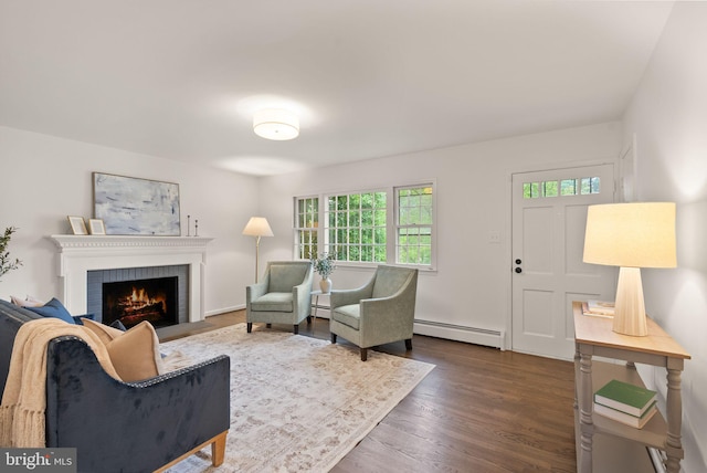 5632 Maxine Ct, Alexandria, VA 22310 - living area with a baseboard radiator, a fireplace, and dark wood finished floors