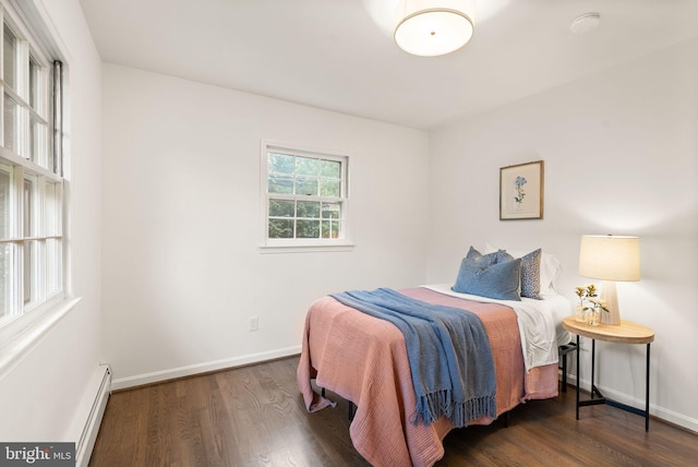 5632 Maxine Ct, Alexandria, VA 22310 - bedroom featuring a baseboard heating unit, wood finished floors, and baseboards