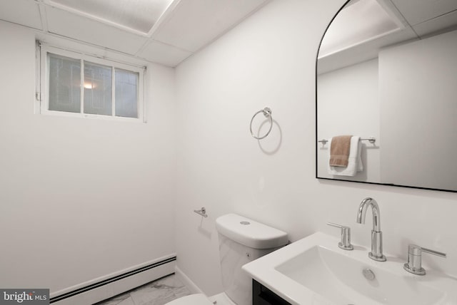 5632 Maxine Ct, Alexandria, VA 22310 - half bath with a baseboard radiator, marble look tile flooring, toilet, a drop ceiling, and baseboards