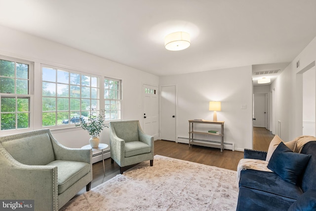 5632 Maxine Ct, Alexandria, VA 22310 - living area featuring baseboard heating, wood finished floors, and baseboards