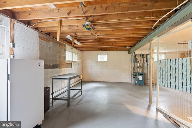 5632 Maxine Ct, Alexandria, VA 22310 - below grade area with freestanding refrigerator, concrete block wall, and baseboard heating