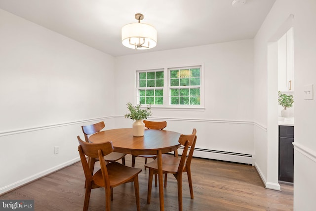 5632 Maxine Ct, Alexandria, VA 22310 - dining space featuring baseboard heating, light wood-type flooring, and baseboards