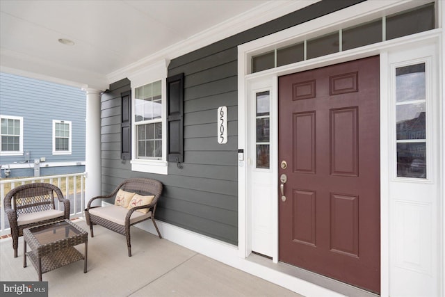 entrance to property featuring a porch