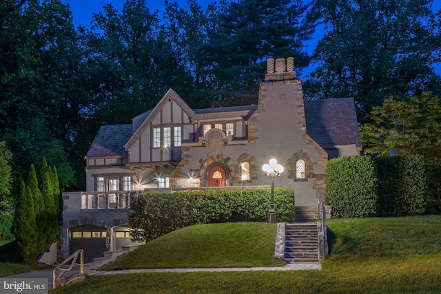 302 Ellsworth Dr, Silver Spring, MD 20910 - tudor house featuring stairway, a chimney, stucco siding, and a yard