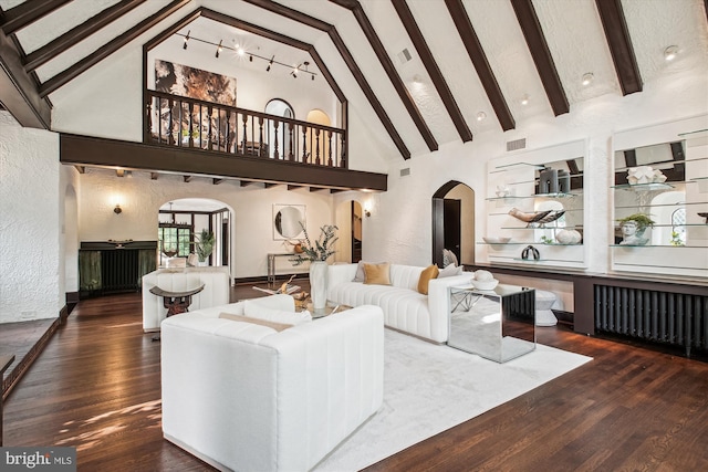 302 Ellsworth Dr, Silver Spring, MD 20910 - living room featuring arched walkways, beamed ceiling, high vaulted ceiling, wood finished floors, and a textured wall