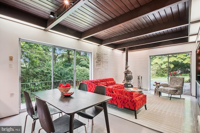 302 Ellsworth Dr, Silver Spring, MD 20910 - dining room featuring wooden ceiling with exposed beams and a wood stove