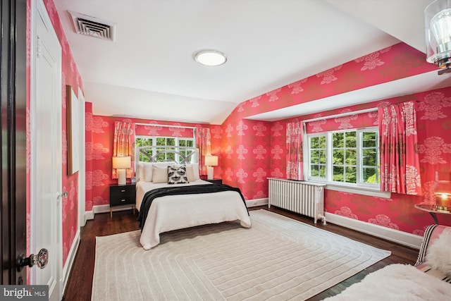302 Ellsworth Dr, Silver Spring, MD 20910 - bedroom with radiator heating unit, wallpapered walls, wood finished floors, vaulted ceiling, and multiple windows