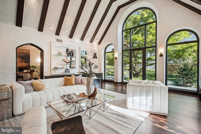 302 Ellsworth Dr, Silver Spring, MD 20910 - living area featuring arched walkways, high vaulted ceiling, healthy amount of natural light, wood finished floors, and beamed ceiling