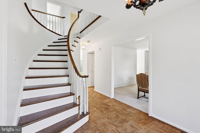 15 Horseshoe Dr, Mount Laurel, NJ 08054 - stairway with baseboards and a chandelier