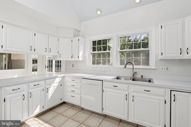 15 Horseshoe Dr, Mount Laurel, NJ 08054 - kitchen with white dishwasher, a sink, lofted ceiling, light countertops, and white cabinetry