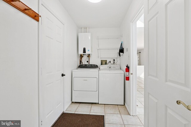 15 Horseshoe Dr, Mount Laurel, NJ 08054 - washroom featuring tankless water heater, washer and clothes dryer, and light tile patterned flooring