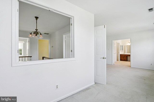 15 Horseshoe Dr, Mount Laurel, NJ 08054 - carpeted spare room featuring a chandelier and baseboards