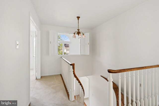 15 Horseshoe Dr, Mount Laurel, NJ 08054 - hall with an upstairs landing, a chandelier, baseboards, and carpet flooring
