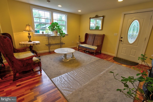 entrance foyer with healthy amount of natural light, baseboards, recessed lighting, and wood finished floors