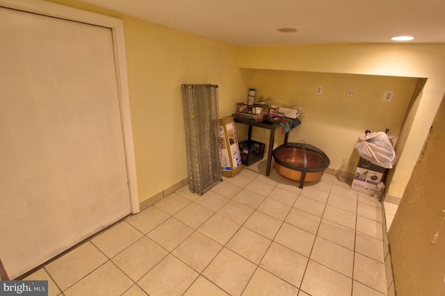 interior space with light tile patterned floors and recessed lighting