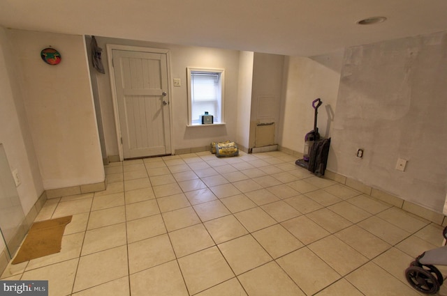 unfurnished room with light tile patterned floors