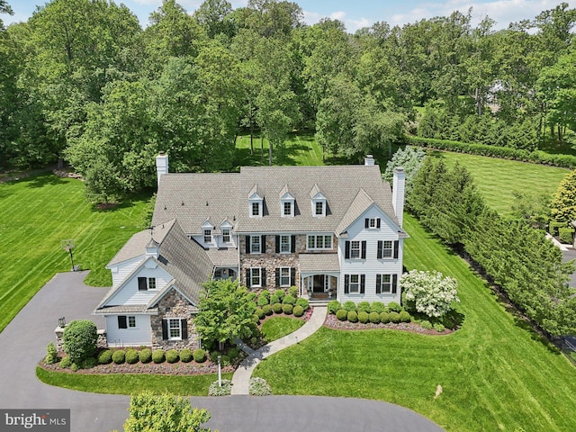 51 Farrier Ln, Newtown Square, PA 19073 - view of front of home featuring a chimney, stone siding, and a front yard