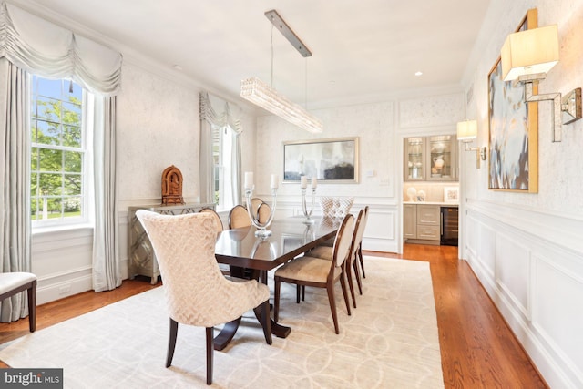 51 Farrier Ln, Newtown Square, PA 19073 - dining area with a decorative wall, healthy amount of natural light, ornamental molding, light wood-type flooring, and wainscoting