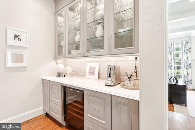51 Farrier Ln, Newtown Square, PA 19073 - bar area with beverage cooler, light wood finished floors, and baseboards