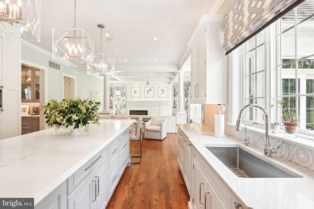 51 Farrier Ln, Newtown Square, PA 19073 - kitchen featuring a sink, a chandelier, dark wood-type flooring, white cabinetry, and open floor plan