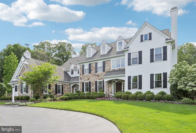 51 Farrier Ln, Newtown Square, PA 19073 - shingle-style home featuring stone siding, a chimney, and a front lawn