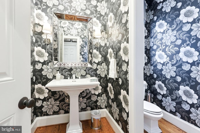 51 Farrier Ln, Newtown Square, PA 19073 - half bath with wallpapered walls, toilet, wood finished floors, and baseboards