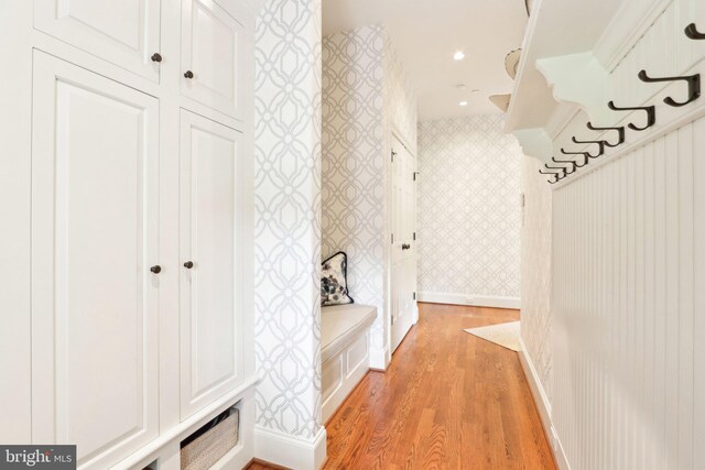 51 Farrier Ln, Newtown Square, PA 19073 - mudroom featuring wallpapered walls, light wood finished floors, and baseboards