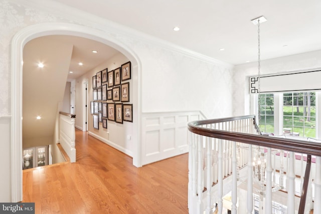 51 Farrier Ln, Newtown Square, PA 19073 - corridor with an upstairs landing, light wood-style flooring, arched walkways, recessed lighting, and ornamental molding